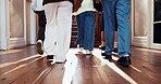 Education, shoes and walking with friends in college for support, learning and scholarship. Feet, university student and low angle with group of people on campus for knowledge, academy and degree