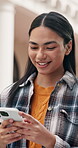 University student, online and happy woman with phone, outdoor or communication with contact on web. Reading, message and person with mobile for exam update, smile and networking on college campus