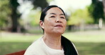 Thinking, breathe and senior Asian woman on bench for reflection, inspiration and relax outdoor. Retirement, happy and elderly person with thought, memory and fresh air for wellness, calm and peace