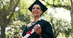 Thinking, woman and student outdoor at graduation, ceremony and mindset for future career. Smile, female graduate or vision in nature with certificate, celebration and degree completion at university