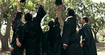 Back, students and throwing caps at graduation, farewell and celebration for degree completion. People, tradition and graduate outdoor with regalia, university achievement and educational milestone