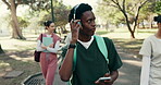 Music, phone and medical student or man in park for future, healthcare and opportunity. Doctor program, nursing internship and headphones with person outdoor for residency training and podcast
