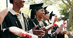 Smile, students and applause at campus at graduation, speech and celebration of degree completion. People, cheering and graduate outdoor with regalia, university recognition and educational milestone