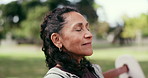 Thinking, breathe and senior woman on bench for reflection, inspiration and relax outdoor. Retirement, happy and elderly person with thought, daydreaming and fresh air for wellness, calm and peace
