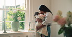 Mother, love and kiss sleeping baby in home with adoration, connection or bonding on maternity leave. Woman, holding infant daughter and affection in house with care, protection or support for growth