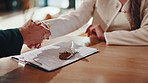 Keys, hands and signature in house with document, lease contract and form for administration. People, legal paperwork or rental agreement on clipboard in home with insurance policy, mortgage or loan