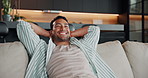 Relax, sofa and happy man watching tv with comfort for stretching, unwind or stress relief in home. Male person, weekend or holiday with smile on couch for entertainment, rest or break in house