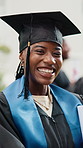 Student, face and happy woman with graduation in university ceremony for academic success. Portrait, female person or graduate with smile, hat or qualification for education or learning achievement