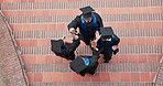 Graduate, success and happy people at ceremony, high five and excited friends with academic growth. University students, above and applause for graduation, laughing and celebration for achievement