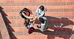 Above, hands together and teamwork in synergy or huddle for university education or study. Group of people, connection and collaboration with students for community, motivation and celebration