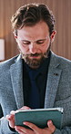 Tablet, corporate and man in company with email, financial compliance or scroll for economy news. Tech, reading and person working in business, investment regulation and asset management policy