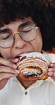 Coffee shop, man and eating croissant for breakfast, sweet craving and bite morning food on break. Male person, hungry and pastry at cafe with delicious treat, relax and customer with dessert