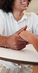 Couple, love and holding hands in cafe with date, conversation and bonding together with commitment. Happy, people and relax in coffee shop with care, relationship and loyalty to romantic partner.