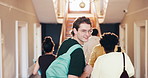 Student, face and man with smile, education and confident with scholarship for academic development. Laughing, portrait and happy person with pride, knowledge and walk with backpack in university
