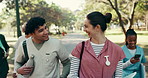 Outdoor, walking and students at college for medical course, nursing school and travel to class. Happy, friends and man with woman greeting on campus for education, learning and bonding at university