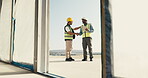 Contractor, team or handshake with tablet at construction site, introduction and digital blueprint. Men, shaking hands or welcome with online plan, inspection or evaluation for engineering in doorway