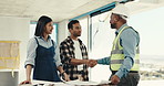 Contractor, couple and remodeling with shaking hands at construction for renovation with plan. Handshake, blueprint and client with builder for home improvement, discussion or agreement for expansion