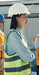 Engineer, woman and listen at construction site with meeting, project feedback and helmet for safety. Supervisor, people and team gathering outdoor with building update, PPE and property development.