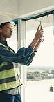 Engineer, tablet and woman at construction site with photography, inspection or property development. Supervisor, person and picture in building with tech, safety compliance and engineering review.