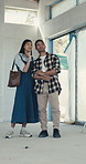 Couple, inspection and discussion with open house for building view or property investment together. Man, woman or homeowners checking apartment renovation for real estate option, choice or home plan