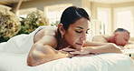 Spa, zen and couple on bed for massage with physical therapy, smile or luxury treatment at resort. Hotel, hospitality and mature people for stress relief, muscle reflexology or holistic detox