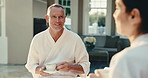 Spa, couple and man with tea, relax and conversation on holiday break for anniversary with love. Mature partner, woman and drink at resort for healthy relationship, care and happy at wellness retreat