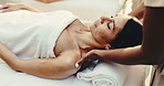 Woman, relax and shoulder massage at spa for holistic wellness service, stress relief and health healing. Mature person, care and therapy with masseuse for peace, calm and pamper for luxury treatment