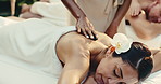 Spa, hot stones and woman with back massage for calm, muscle tension and stress relief at resort. Hospitality, person and masseuse with thermal treatment for holistic healing, wellness and self care