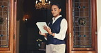 Woman, concierge and scroll with tablet at front door for hotel, welcome and booking accommodation. Lobby, receptionist and digital tech for guest, reservation and customer service for hospitality