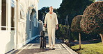 Happy, man and arrival at hotel with suitcase, check in and accommodation for holiday abroad. Thinking, mature person and walk outdoor with luggage, guest service and resort entrance on vacation trip