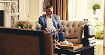 Hotel, lounge and businessman with phone, scroll and relax at reception on business trip. Hospitality, travel accommodation and mature person in lobby with digital tech, luggage and online check in