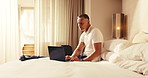 Hotel, laptop and business man on bed for conference schedule, agenda and planning on work trip. Hospitality, travel and mature person on computer for research, convention itinerary and check booking