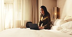 Hotel, laptop and business woman on bed for conference schedule, agenda or planning on work trip. Hospitality, travel and mature person on computer for check in, convention itinerary and reservation