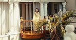 Resort, balcony and woman with smile, sightseeing and contemplating on weekend, tourism and holiday. Happy, tourist and mature person on break, positive attitude and thinking on vacation in hotel