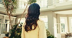 Thinking, calm or woman in hotel with walking, trip mindset or mindfulness on summer holiday. Back, stroll or mature person in resort with daydreaming, reflection or peaceful perspective in getaway.