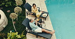 Champagne, pool and couple in hotel with drink, holiday and bonding together for relationship. Above, mature people and love in villa with cheers, hospitality and wine for anniversary celebration