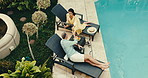 Champagne, pool and couple in hotel with toast, holiday and bonding together for relationship. Above, mature people and love in villa with cheers, hospitality and celebration drink for anniversary