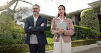 Face, realtor and team outdoor by home with tablet, arms crossed and work together to sell property. Confident, mature people and real estate agent in front yard with new house, tech and partnership.