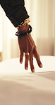 Person, hand and bedroom with sheet in hotel for clean fabric, hygiene or comfort with duvet. Feeling, texture or touch with bed for relaxation or calm soothing in luxury accommodation or hospitality