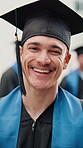 Graduation, face and man on campus with laugh, college pride and optimism in academic achievement. Education, happy or university student with joke reaction, confidence or success in diploma ceremony