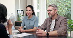 Communication, office and couple with financial advisor for advice, investment planning and assets. Woman, mature clients and talk by paperwork for wealth management, finance goals or coverage