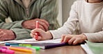 Coloring, hands and child with grandparent in home, skill development or learn with creative project. Family, senior man and kid with assignment, knowledge and cognitive growth with crayon in house