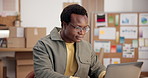 Ecommerce, man and typing in business with laptop, research or check customer database for logistics. Black person, sales stats and insights in retail company with computer, supply chain or forecast.