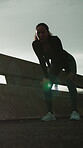 Athlete, fitness and woman with fatigue, bridge and tired after workout routine or wellness in city. Flare, runner and person with burnout on break, breathe and thinking post exercise and low angle