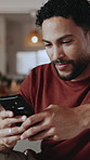 Texting, phone or man in home with thinking, online chat or message response on social media. Typing, digital and person with technology, communication and post reflection on virtual platform.