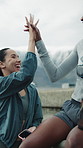 Friends, laugh and high five in city with fitness goals, support or workout break outdoor on weekend. Downtown, happy women and conversation with joke, wellness and celebration for training success.