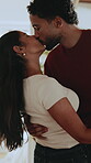 Love, kiss or couple in living room with dance, romantic moment or bonding together on weekend break. Affection, groove or people in home with embrace, rhythm or fun connection in happy relationship
