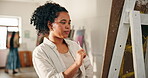 Painting, thinking and class with woman in workshop for creative, inspiration and brush stroke technique. Passion project, artist hobby and easel with people in studio for design, vision and art