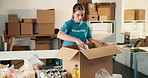 Woman, packing and box with food for donations, collection and non profit for community outreach. Person, volunteer or groceries in cardboard for delivery, pantry goods and package for poverty relief