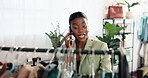 Phone call, happy and black woman in clothing store for communication, stock enquiry or order. Female person, fashion startup and laugh by rail for customer service, restock and supplier update